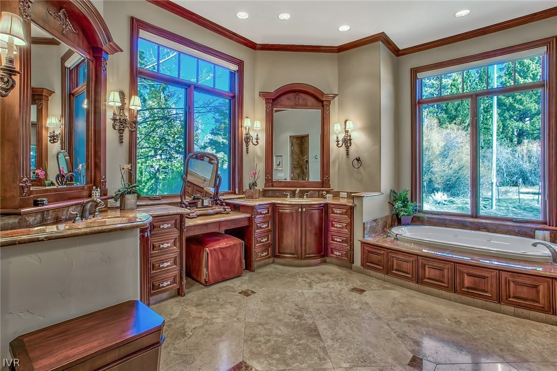 550 Sierra Sunset Lane Zephyr Cove, NV 89448 - Photo 14 of 35 a large spacious bathroom with a large tub and sink