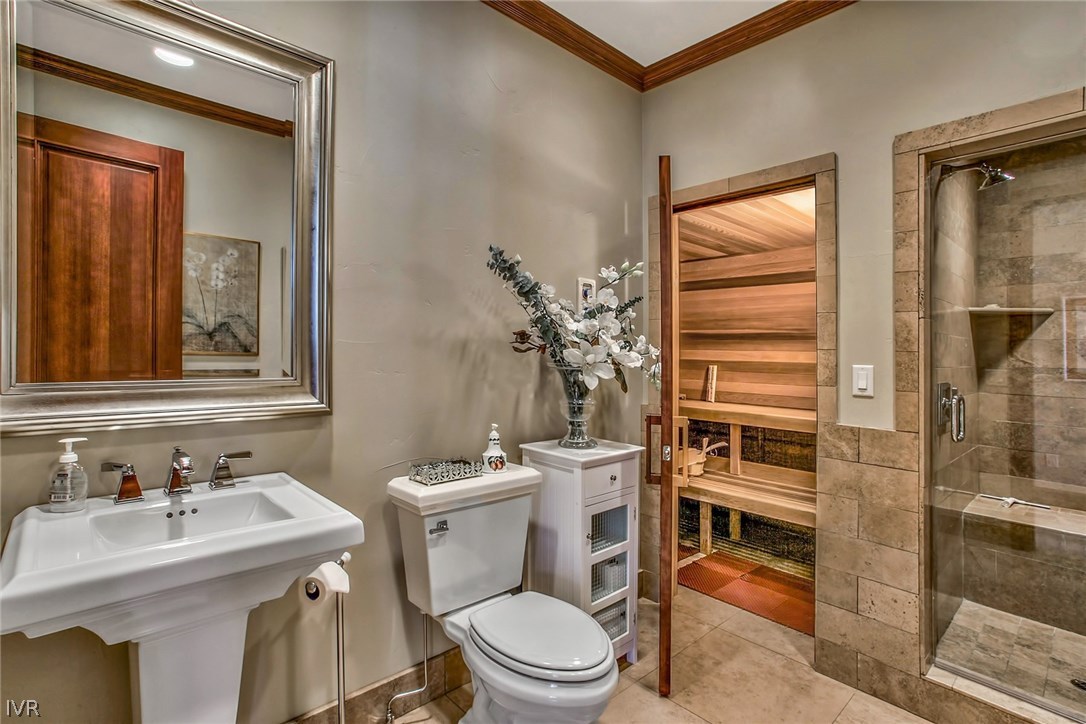 550 Sierra Sunset Lane Zephyr Cove, NV 89448 - Photo 16 of 35 a bathroom with a sink a toilet and shower