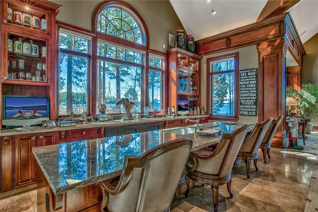 550 Sierra Sunset Lane Zephyr Cove, NV 89448 - Photo 19 of 35 a view of a dining room with furniture large windows and wooden floor