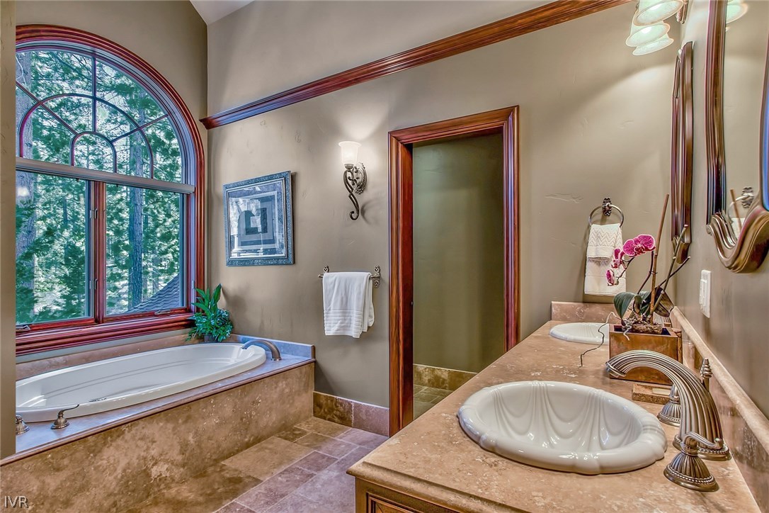 550 Sierra Sunset Lane Zephyr Cove, NV 89448 - Photo 27 of 35 a room with furniture and a mirror