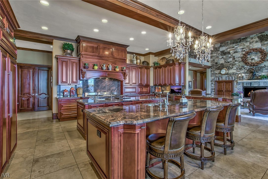 550 Sierra Sunset Lane Zephyr Cove, NV 89448 - Photo 10 of 35 a kitchen with stainless steel appliances granite countertop a stove and a refrigerator