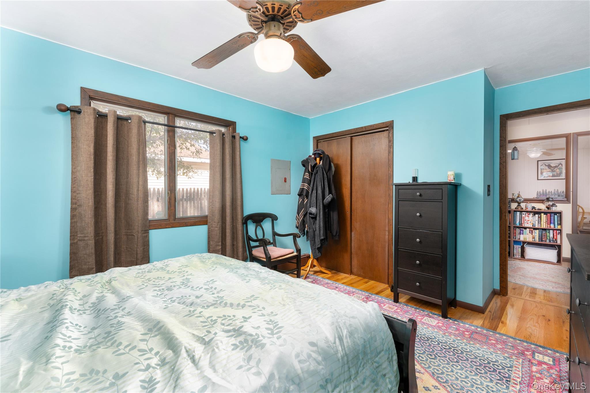 16 Daisy Place Selden, NY 11784 - Photo 11 of 19 a bedroom with a bed and a chandelier