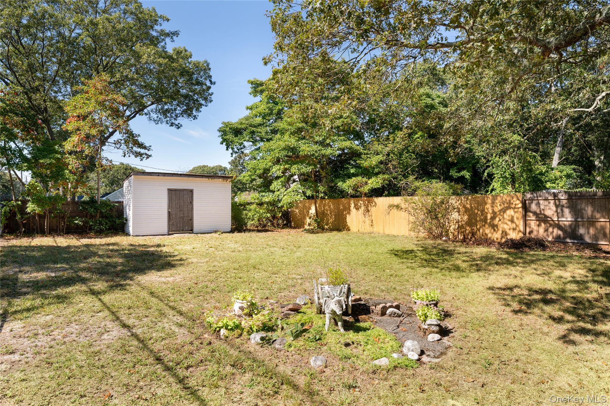16 Daisy Place Selden, NY 11784 - Photo 17 of 19 a view of a yard with a house