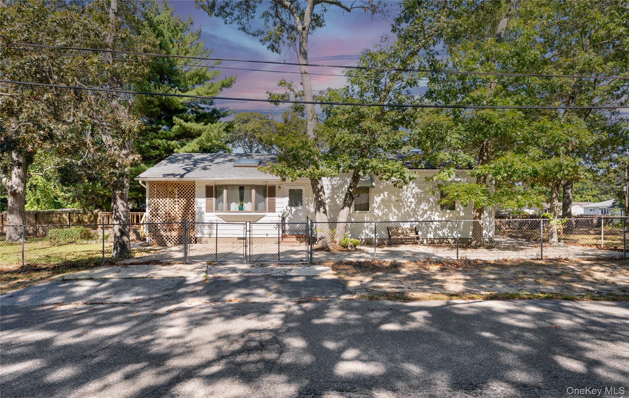 16 Daisy Place Selden, NY 11784 - Photo 2 of 19 a front view of a house with a garden