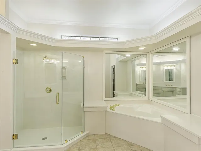 a bathroom with a shower and a tub
