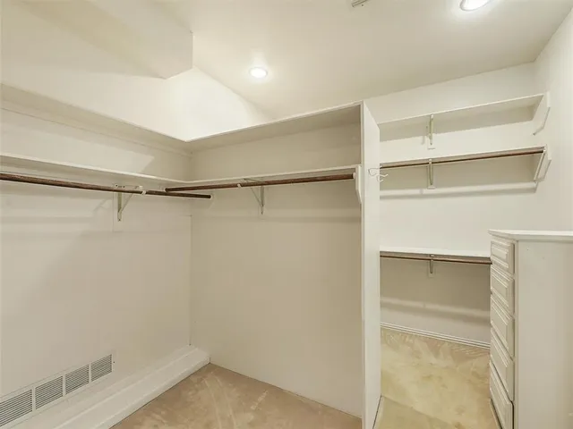 a view of an empty walk in closet