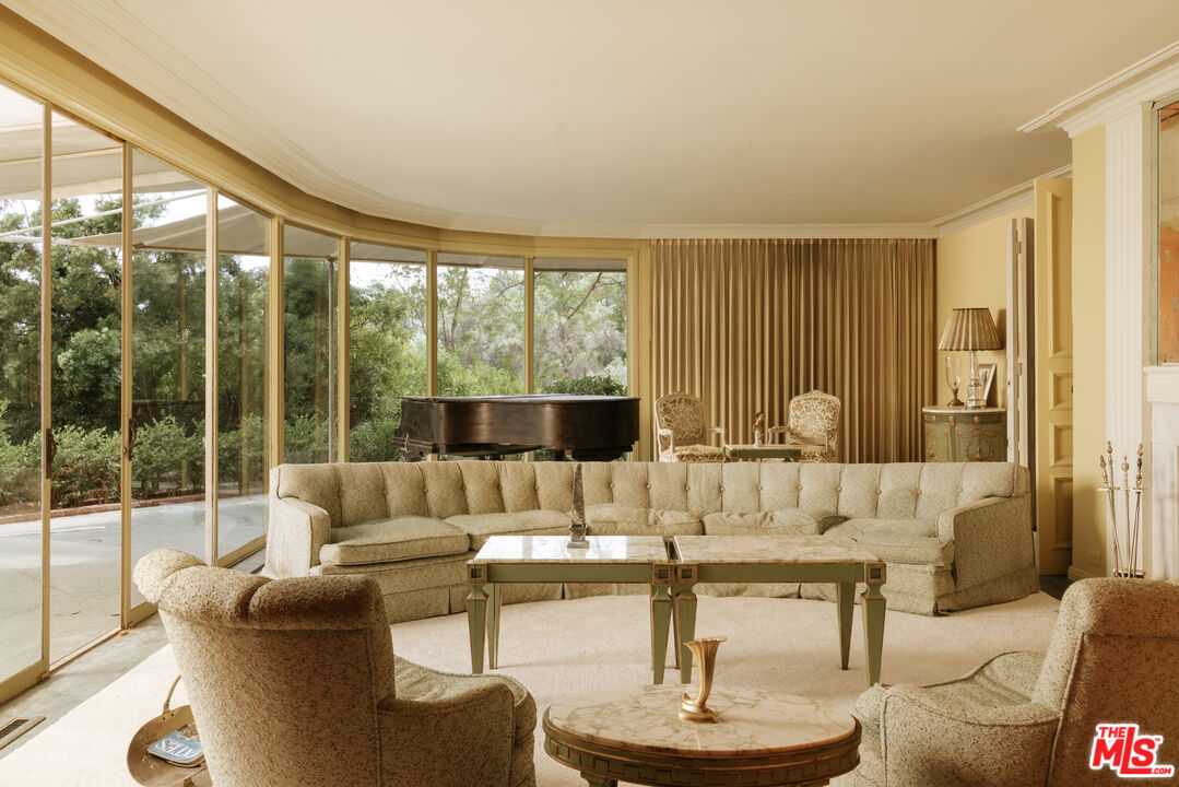 10934 Bellagio Road Los Angeles, CA 90077 - Photo 12 of 47 a living room with furniture and a large window
