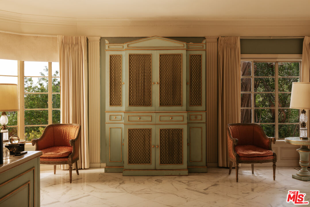10934 Bellagio Road Los Angeles, CA 90077 - Photo 18 of 47 a balcony with furniture and a potted plant