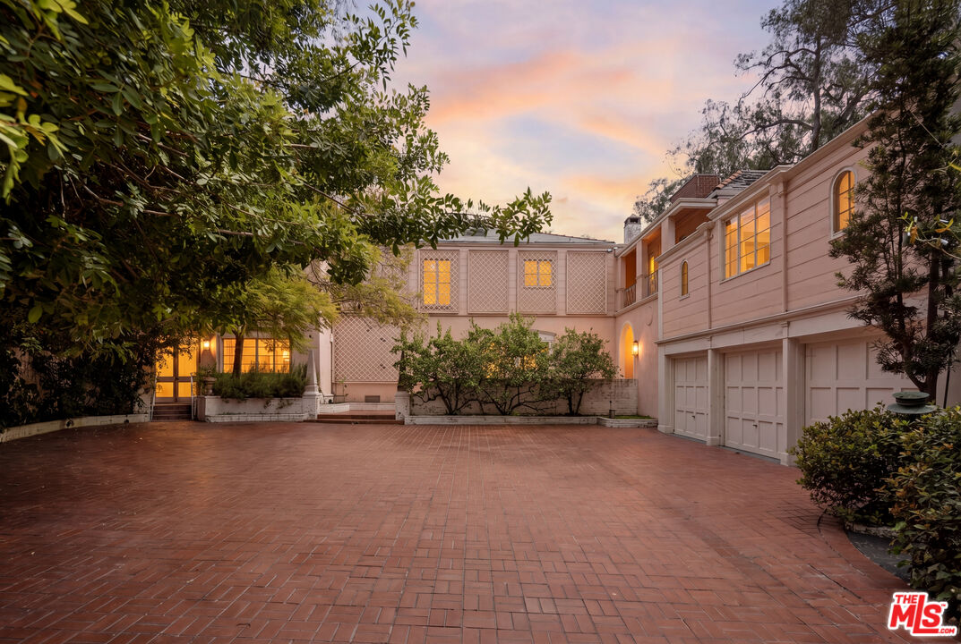 10934 Bellagio Road Los Angeles, CA 90077 - Photo 2 of 47 a view of a house with a street