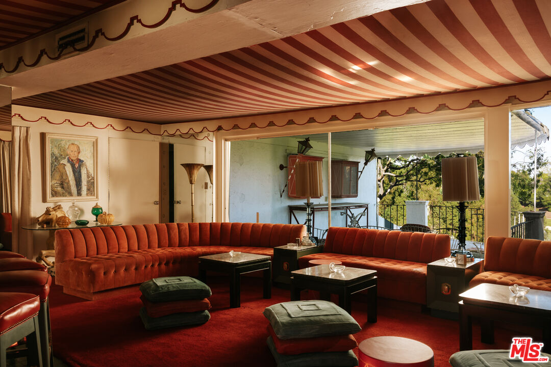 10934 Bellagio Road Los Angeles, CA 90077 - Photo 21 of 47 a living room with furniture and a large window