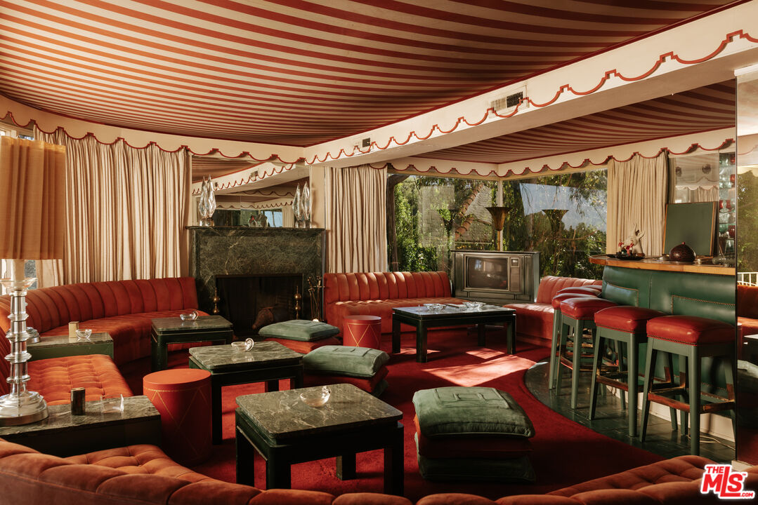 10934 Bellagio Road Los Angeles, CA 90077 - Photo 22 of 47 a outdoor living space with patio furniture and a fireplace