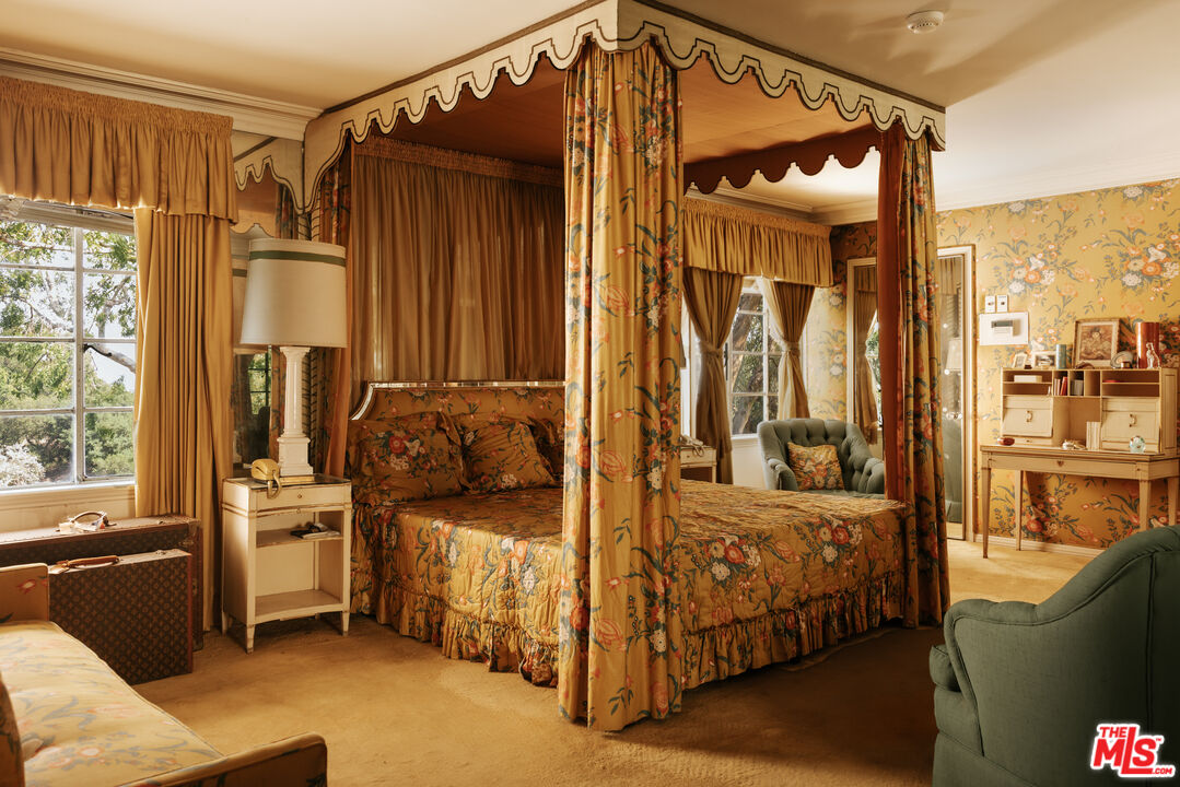 10934 Bellagio Road Los Angeles, CA 90077 - Photo 27 of 47 a bedroom with furniture and a window