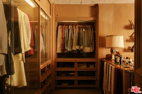 a view of a house with a wooden fence