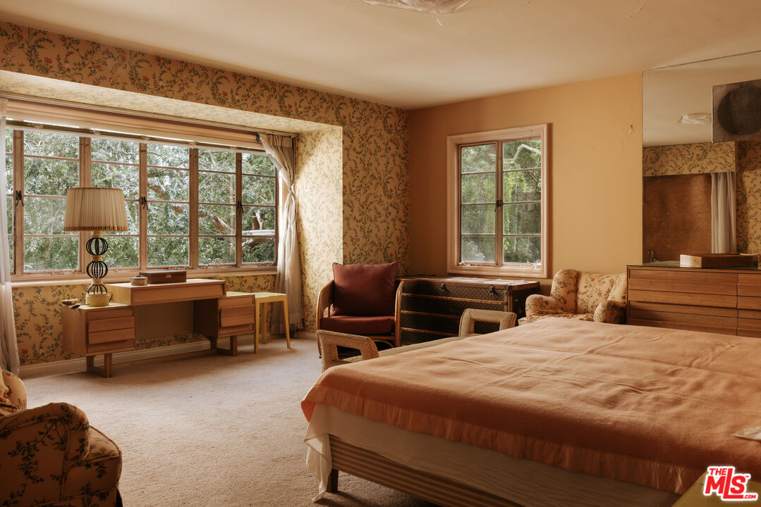 10934 Bellagio Road Los Angeles, CA 90077 - Photo 33 of 47 a bedroom with a bed and a large window
