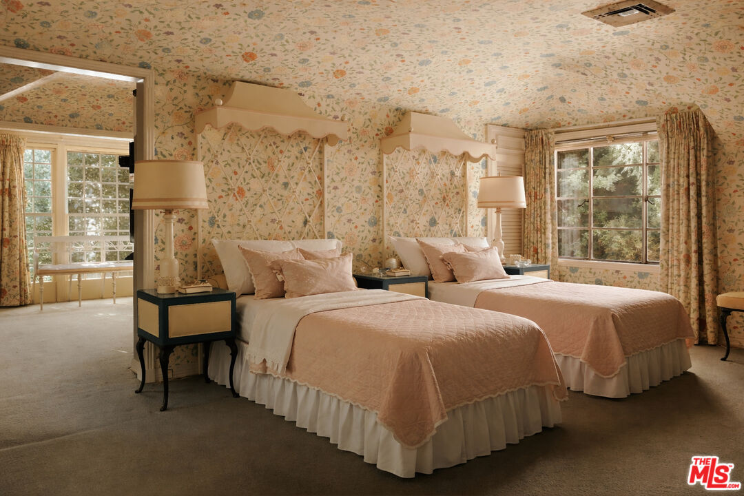10934 Bellagio Road Los Angeles, CA 90077 - Photo 34 of 47 a bedroom with two beds and large window