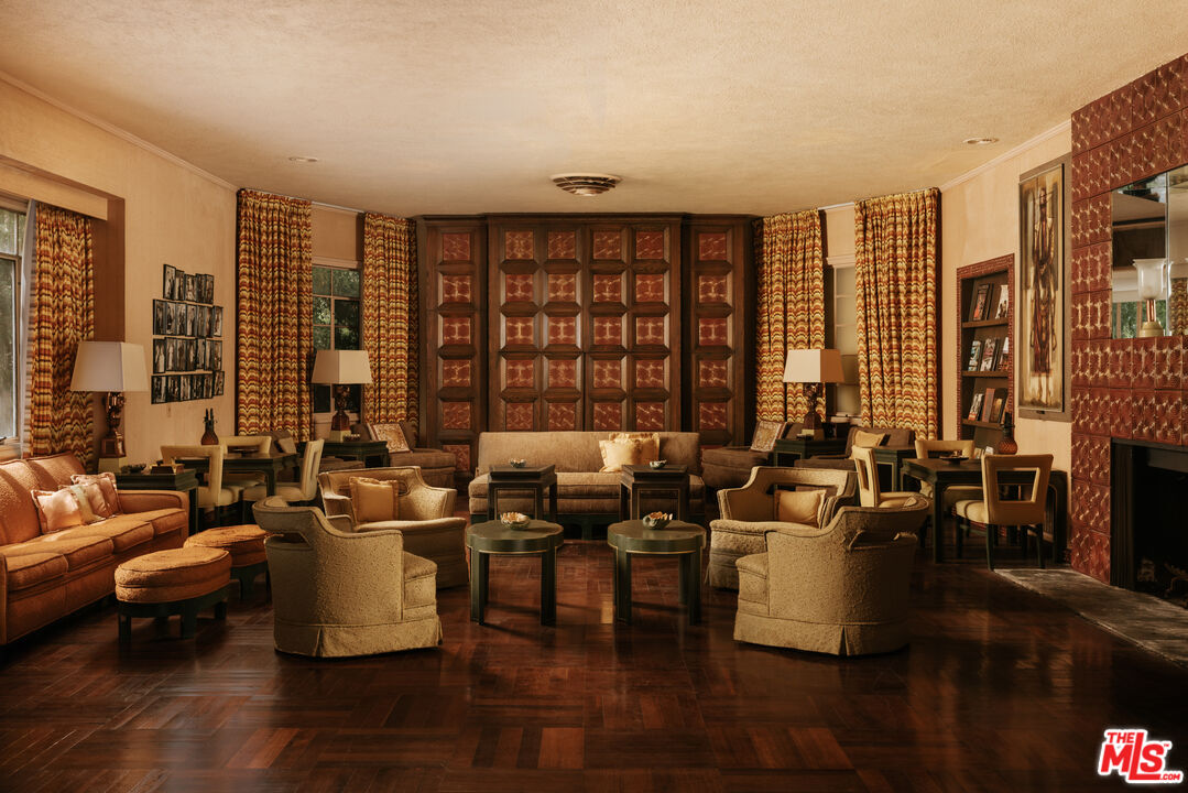 10934 Bellagio Road Los Angeles, CA 90077 - Photo 6 of 47 a living room with furniture and large windows