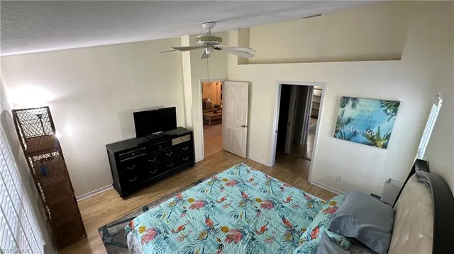 a bedroom with a bed and a television