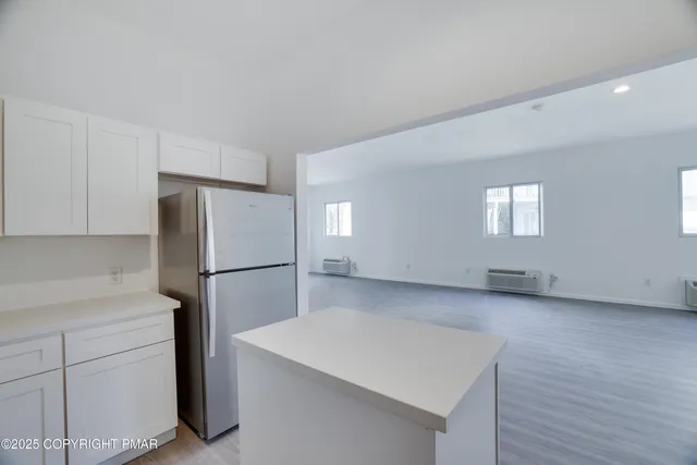 a kitchen with a refrigerator a sink and dishwasher