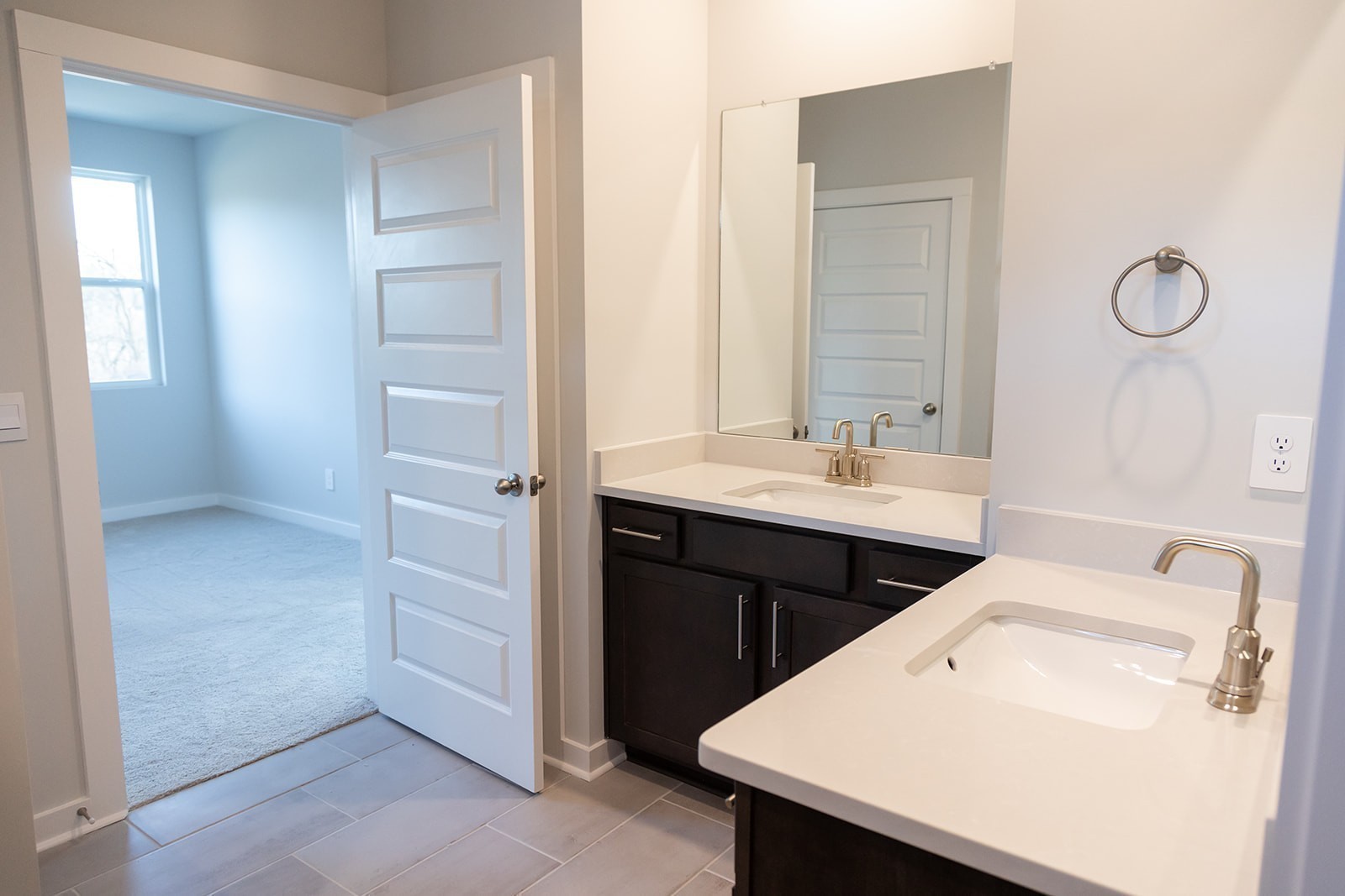 305 Apollo Way Gallatin, TN 37066 - Photo 10 of 46 a bathroom with a double vanity sink a mirror and a shower