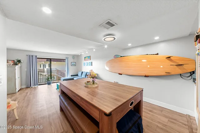 a living room with furniture flat screen tv and a fireplace