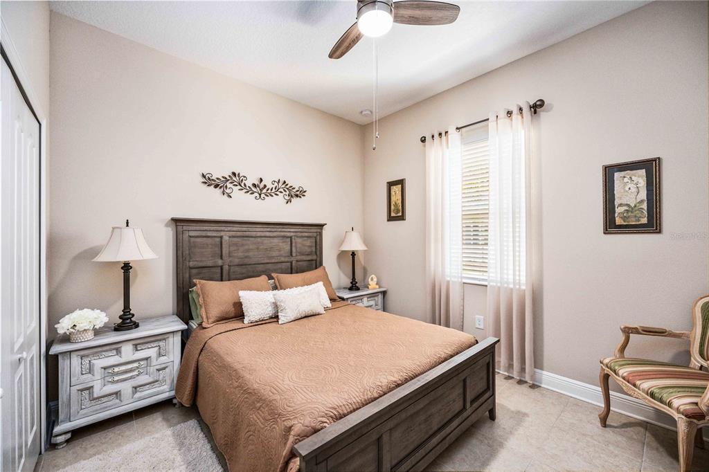 1759 Nottingham Trail Punta Gorda, FL 33980 - Photo 13 of 27 a bedroom with a bed and a window