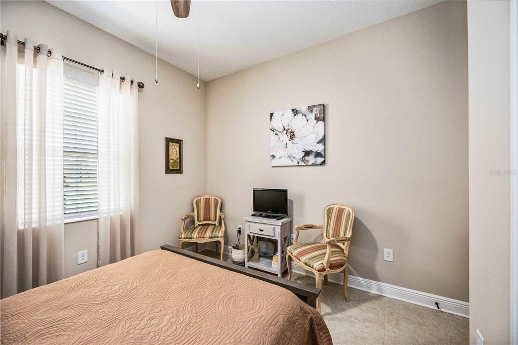 1759 Nottingham Trail Punta Gorda, FL 33980 - Photo 14 of 27 a bedroom with a bed and a desk