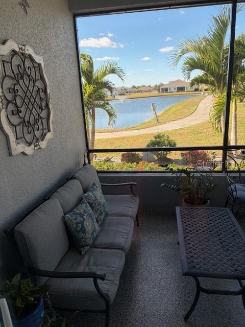 1759 Nottingham Trail Punta Gorda, FL 33980 - Photo 15 of 27 a living room with furniture and a floor to ceiling window