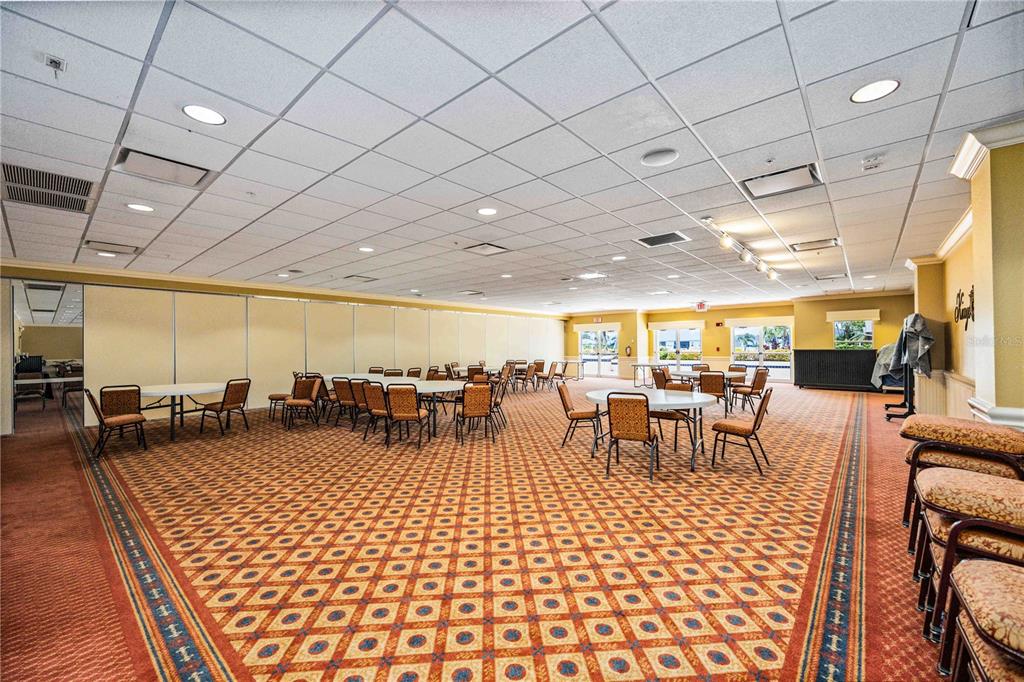 1759 Nottingham Trail Punta Gorda, FL 33980 - Photo 21 of 27 a room with lots of tables a large window and chairs