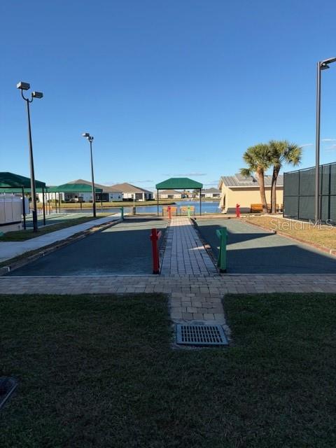 1759 Nottingham Trail Punta Gorda, FL 33980 - Photo 26 of 27 a view of a swimming pool with a yard