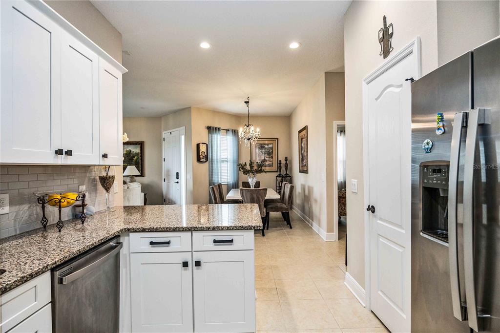1759 Nottingham Trail Punta Gorda, FL 33980 - Photo 8 of 27 a kitchen with stainless steel appliances granite countertop a refrigerator and a sink