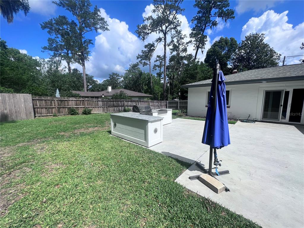 2707 Northwest 4th Avenue Gainesville, FL 32607 - Photo 16 of 31 a view of backyard with a slide