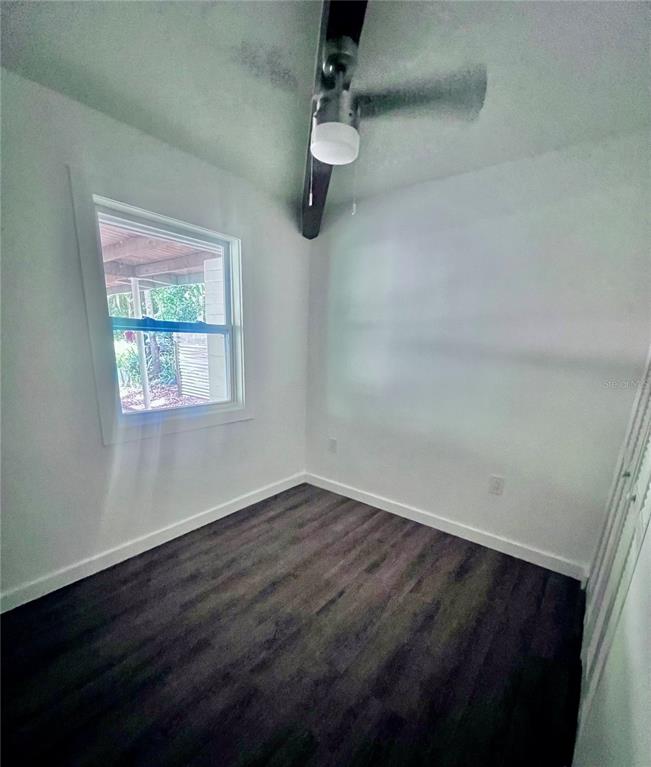 2707 Northwest 4th Avenue Gainesville, FL 32607 - Photo 17 of 31 a view of a room with wooden floor fan and window