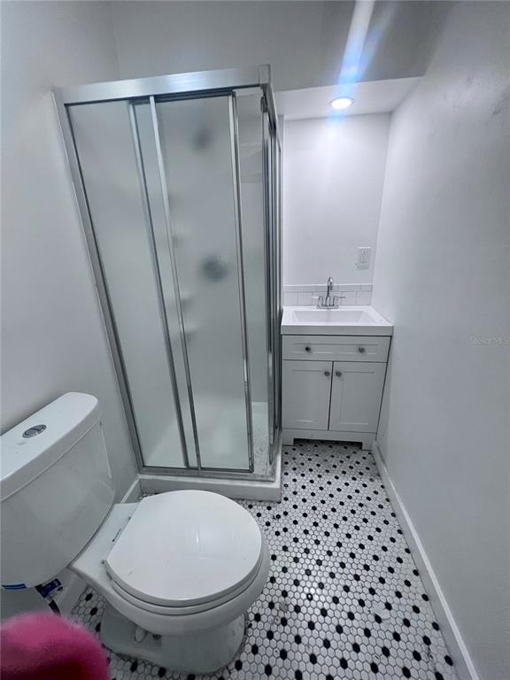 2707 Northwest 4th Avenue Gainesville, FL 32607 - Photo 18 of 31 a bathroom with a sink toilet and shower