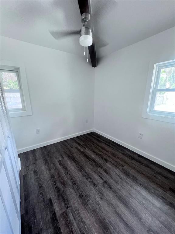 2707 Northwest 4th Avenue Gainesville, FL 32607 - Photo 19 of 31 a view of a room with wooden floor and window