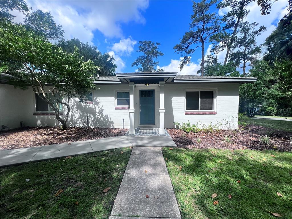 2707 Northwest 4th Avenue Gainesville, FL 32607 - Photo 2 of 31 a front view of a house with garden