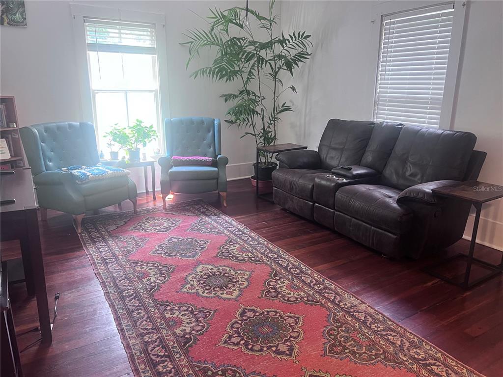 2707 Northwest 4th Avenue Gainesville, FL 32607 - Photo 26 of 31 a living room with furniture and a potted plant