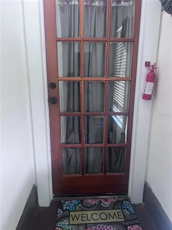 a kitchen with a sink cabinets and wooden floor