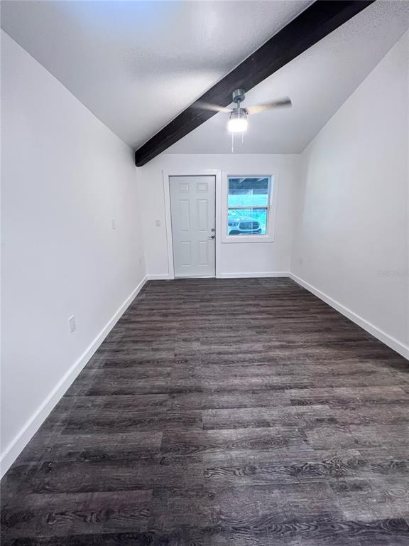 2707 Northwest 4th Avenue Gainesville, FL 32607 - Photo 31 of 31 an empty room with wooden floor and windows