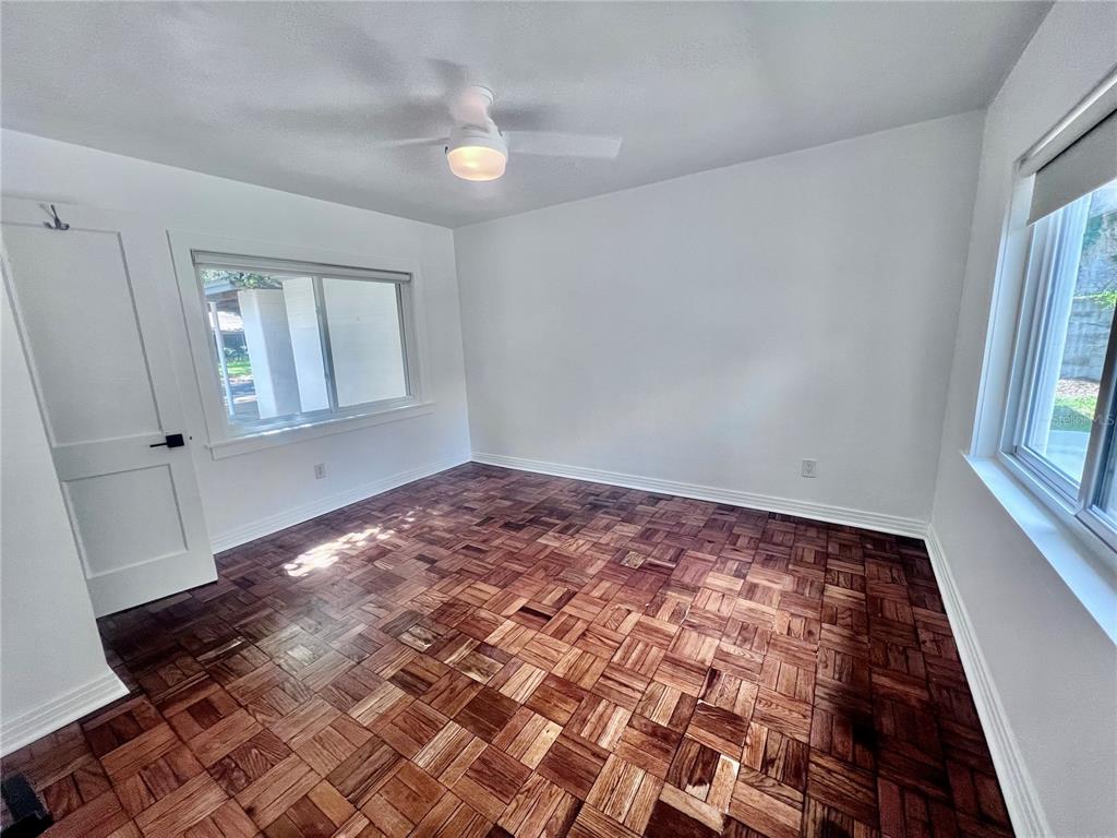 2707 Northwest 4th Avenue Gainesville, FL 32607 - Photo 6 of 31 wooden floor in an empty room with a window