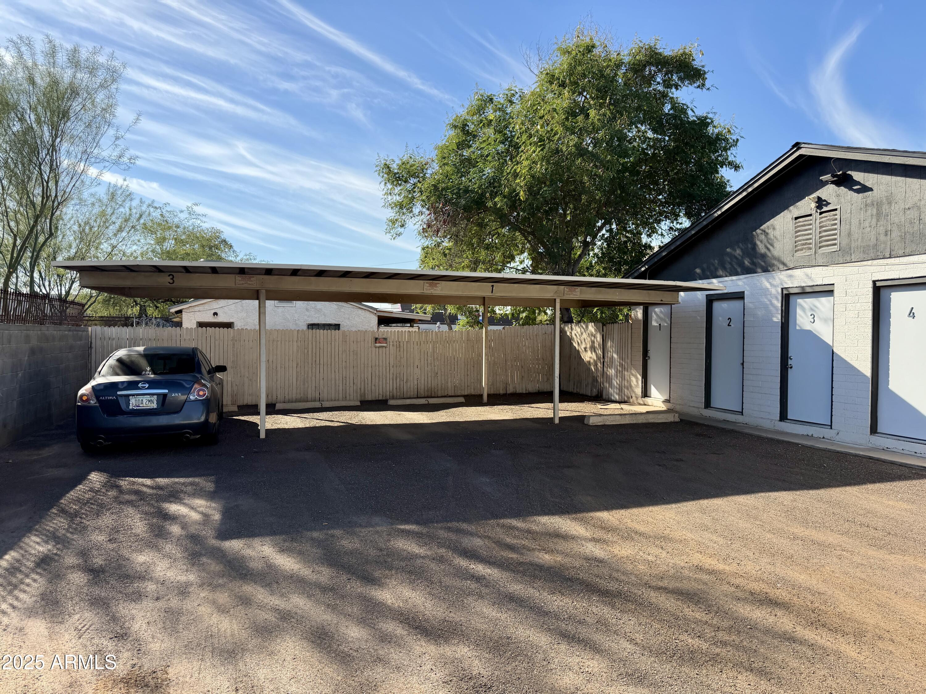 5027 North 16th Avenue, Unit 1 Phoenix, AZ 85015 - Photo 3 of 9 a car parked in front of a house