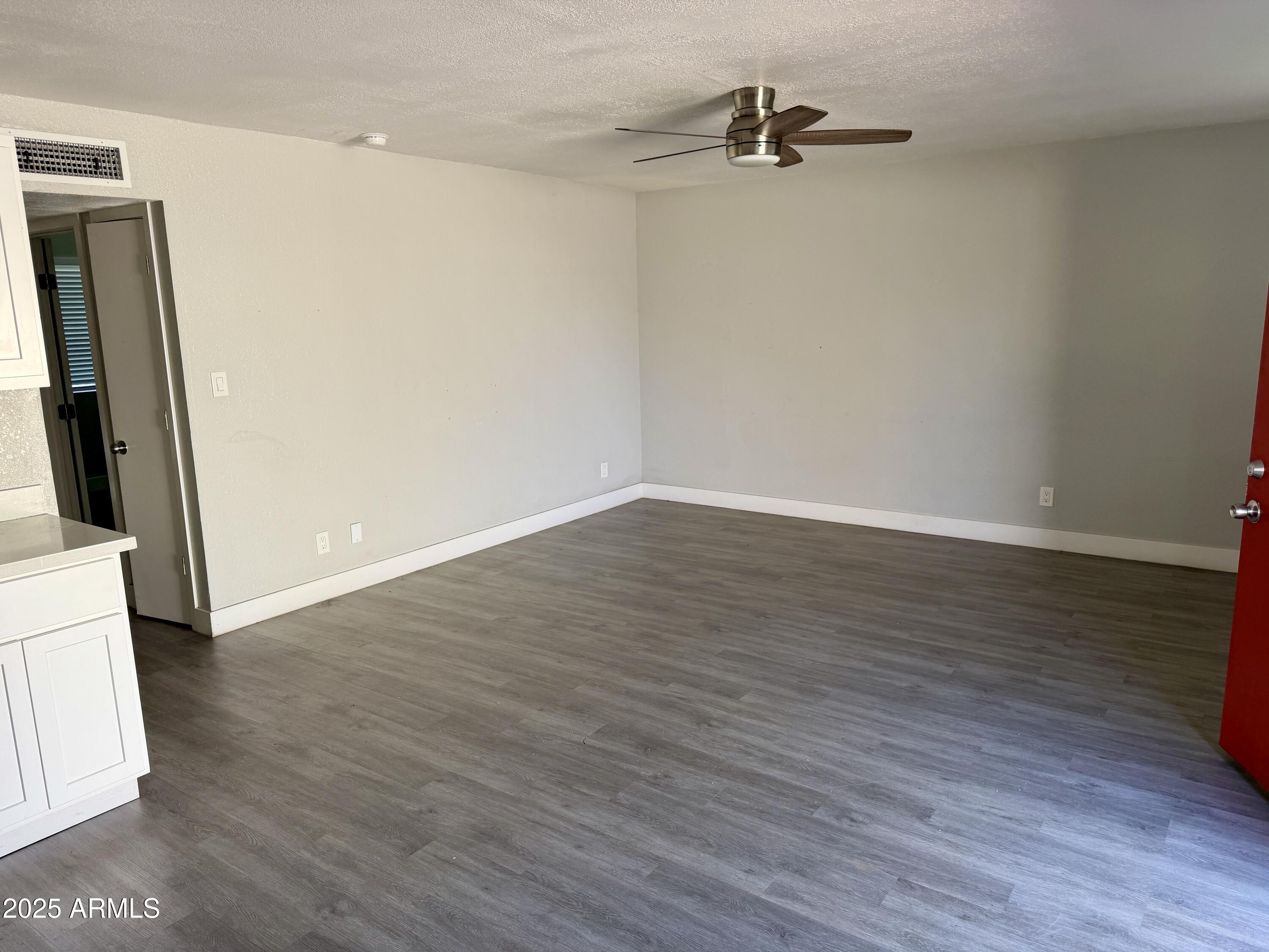 5027 North 16th Avenue, Unit 1 Phoenix, AZ 85015 - Photo 5 of 9 wooden floor in an empty room