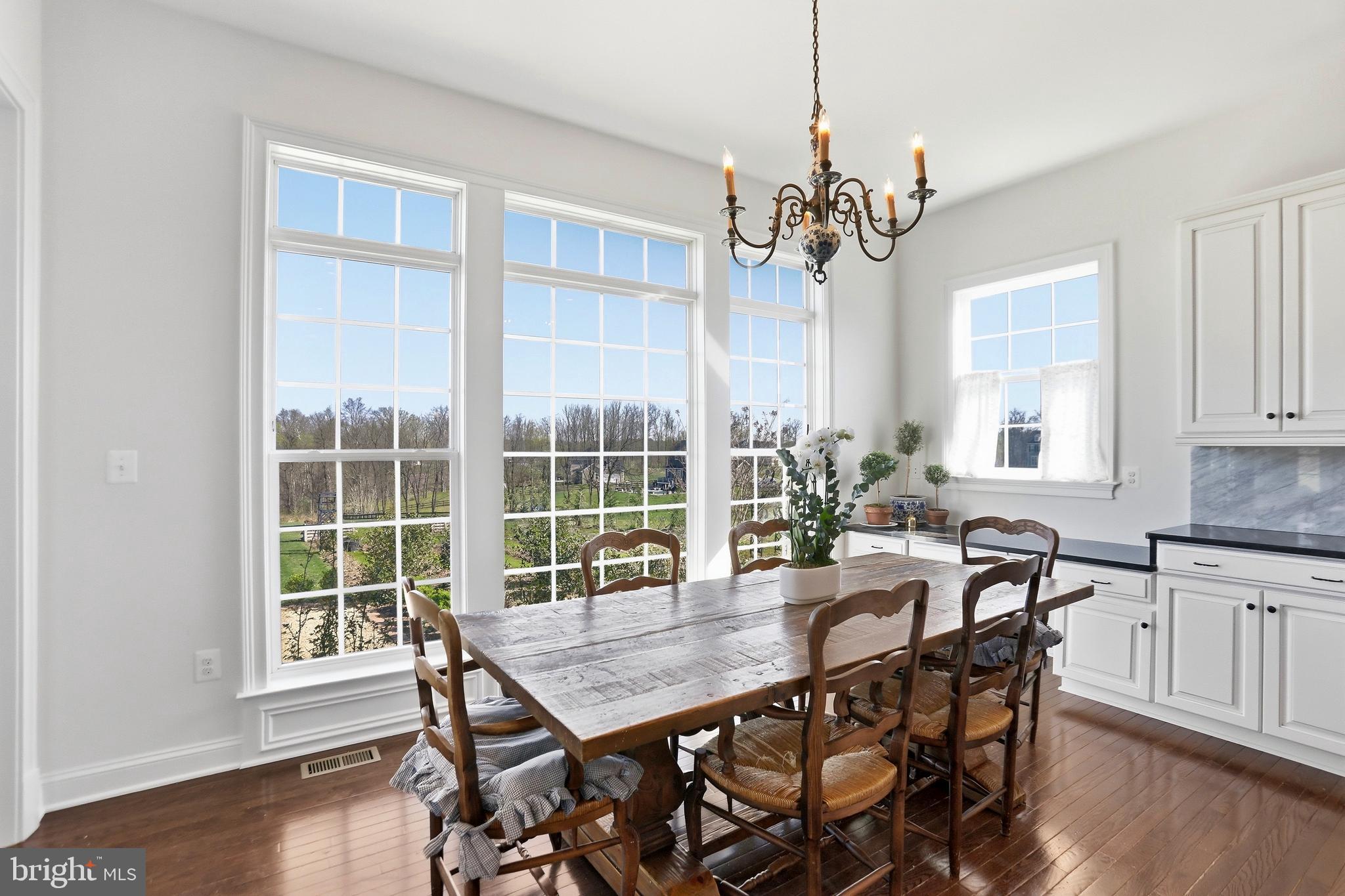 36972 Bridle Ridge Lane Purcellville, VA 20132 - Photo 15 of 44 a view of a dining room with furniture window and wooden floor