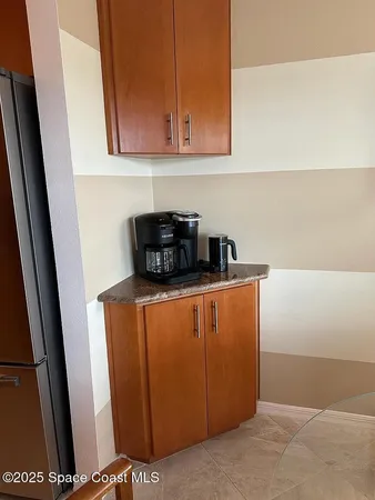 a kitchen with a refrigerator