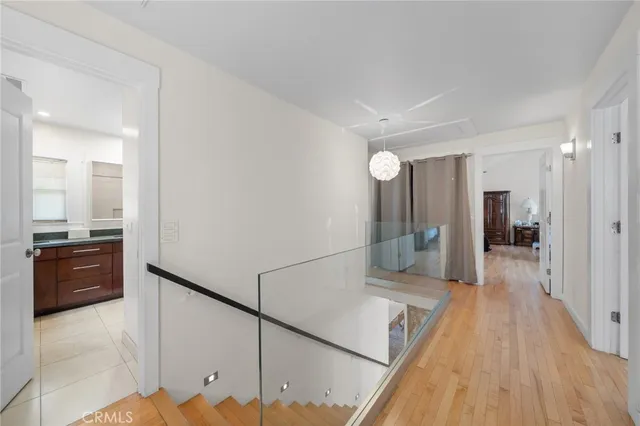 a view of a hallway and wooden floor