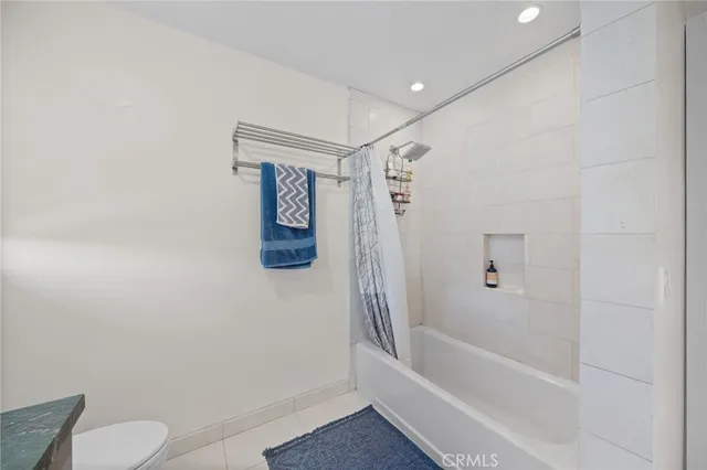 a bathroom with a shower and a toilet