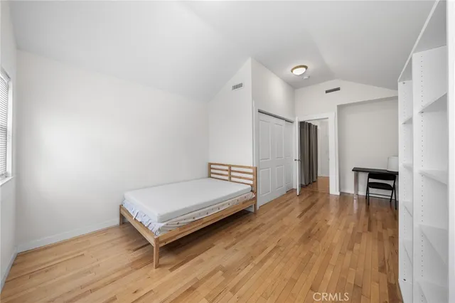 a spacious bedroom with a bed and a table