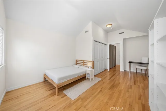 a spacious bedroom with a bed and a table