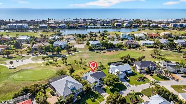 an aerial view of residential houses with outdoor space