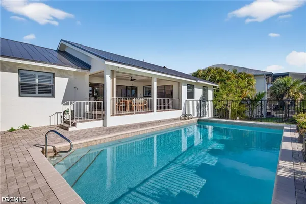 a house view with a sitting space and balcony