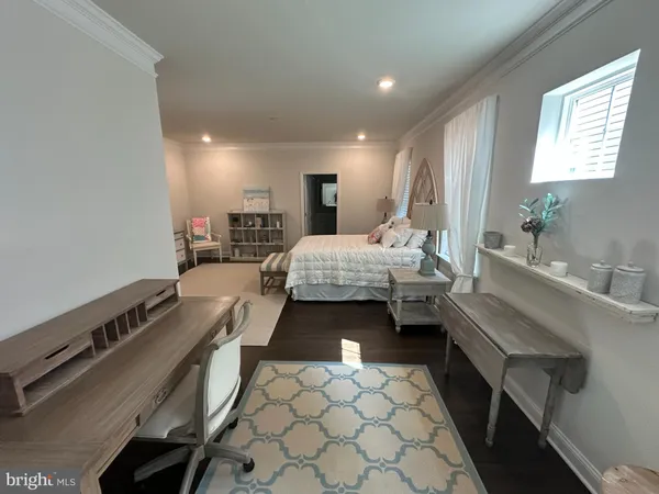 a bedroom with a bed and a table in it